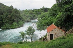 One of many impressive waterfalls in Krka National Park. Beautiful waterfall in between large trees in Krka National Park.
