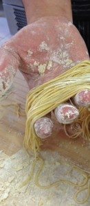 Freshly made pasta Freshly made pasta in person's hand
