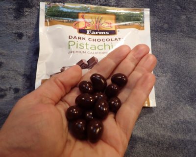Dark Chocolate Pistachios in Hand dark chocolate pistahios 1