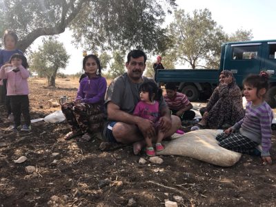 A family rests after harvesting olives on the olive trail in Jordan