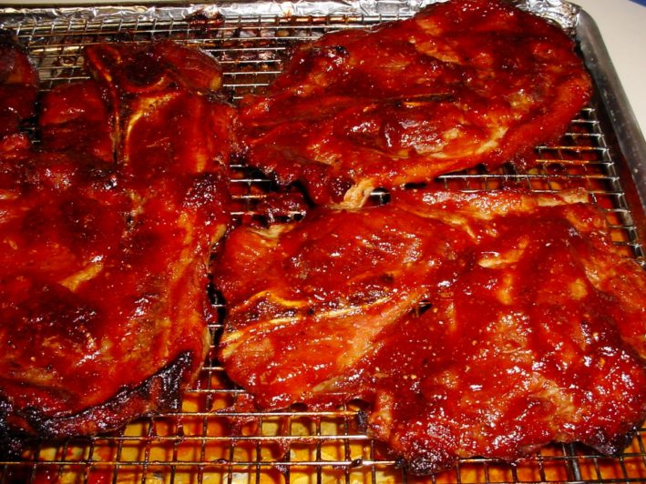 Sauce-slathered pork steaks from St. Louis, Missouri.