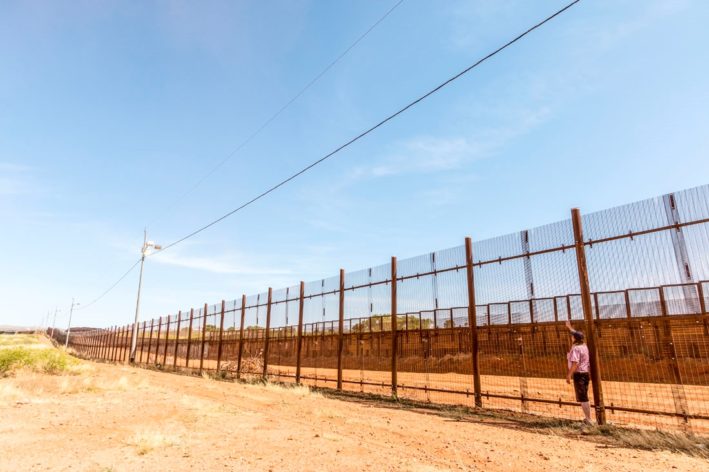 The border fence between Tucson, Arizona and Mexico.