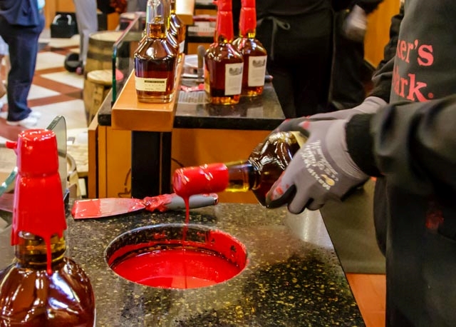 Tour the Maker's Mark Distillery and put the red wax on the bottles.