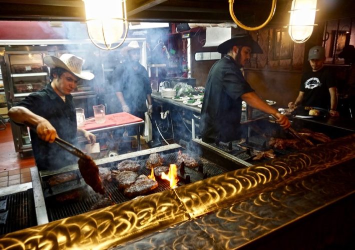 Cowboys grill at the Big Texan Steak Ranch Brewery in Amarillo, Texas, one of the things to do in Palo Duro Canyon National Park.