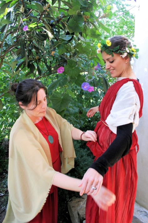 A guest gets her robe adjusted in Spain's Roman Spa.