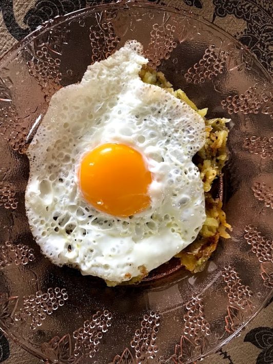 Vital Farms egg over easy over hash browns.