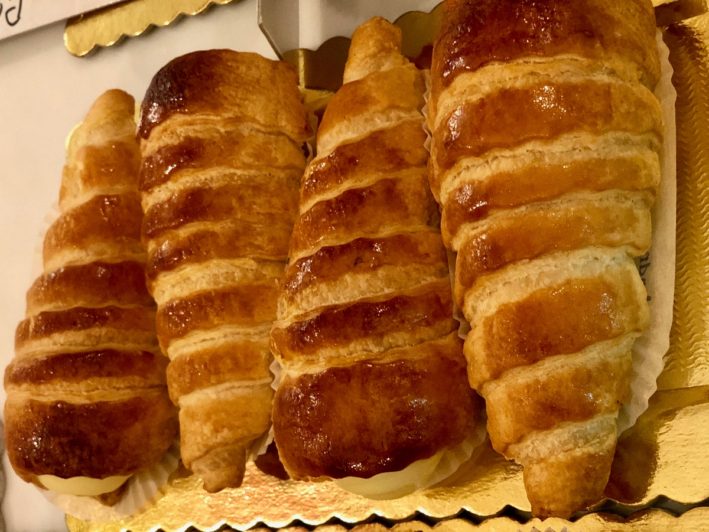 Enjoying these horn pastries is part of the coffee culture in Rome.