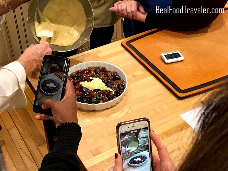Taking pictures of a dessert being made at Savory Spoon Cooking School.