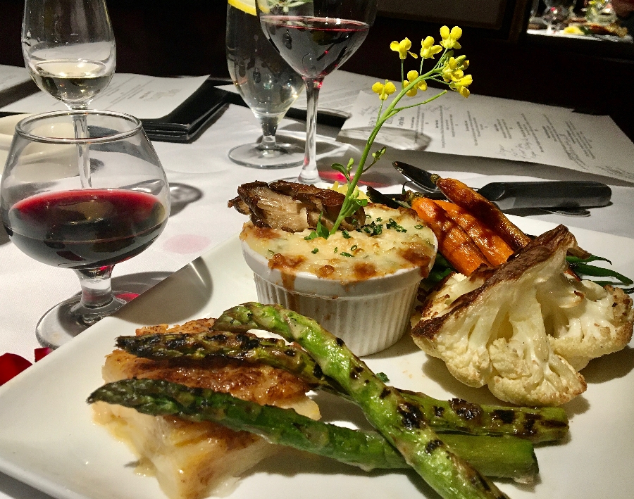 A vegetarian entree includes cauliflower and asparagus.