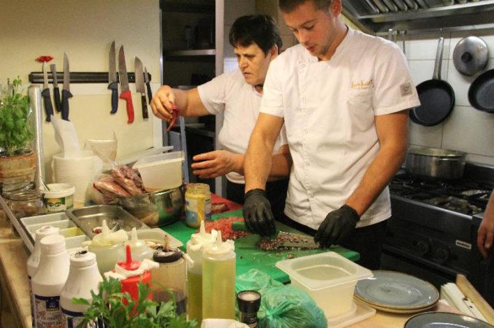 Cooks at Lucin Kantun in Old Town Dubrovnik prepare lunch.