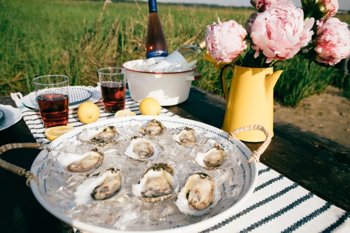 Virginia Beach oysters on the half shell on a table.
