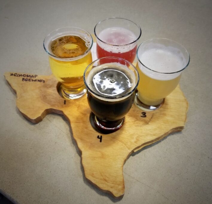 A flight of beer on a Texas map from Roadmap Brewing in San Antonio.