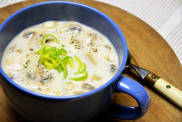 A blue bowl of Jenny Lake Lodge Mushroom Lavender Soup.
