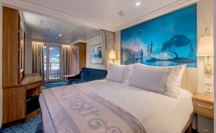A state room on the Disney ship with a mural above the bed.