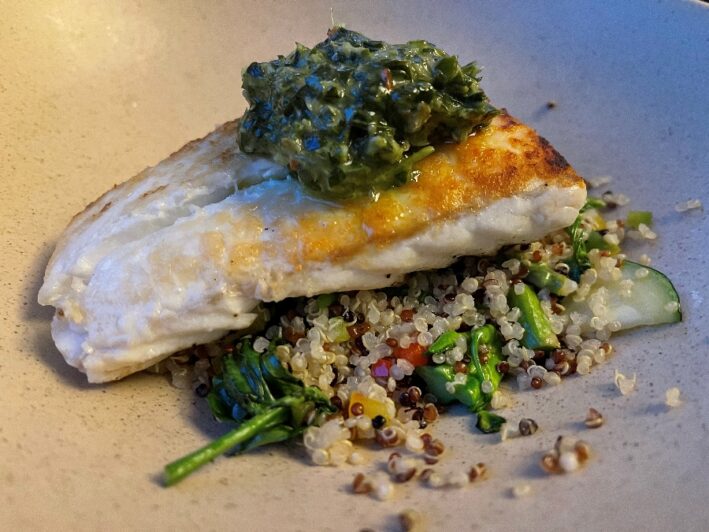 Halibut filet with green pesto sauce on a bed of quinoa at the Grand Hyatt Vail.