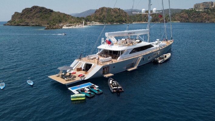 Gulet boat stops and lets guests play in the water.