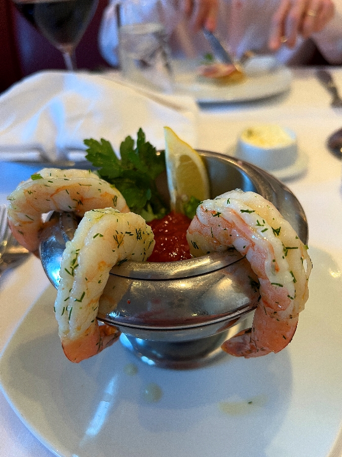 Shrimp cocktail in silver bowl at Cagney's Steakhouse.
