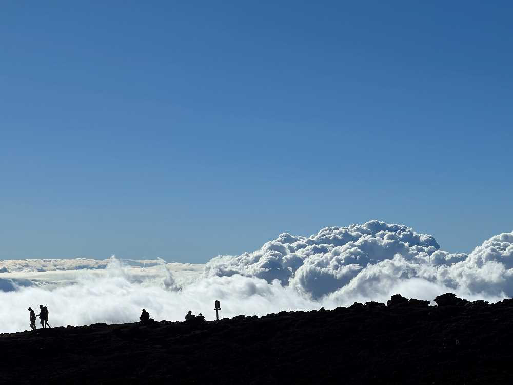 People walking on paths at Haleakala National Park.