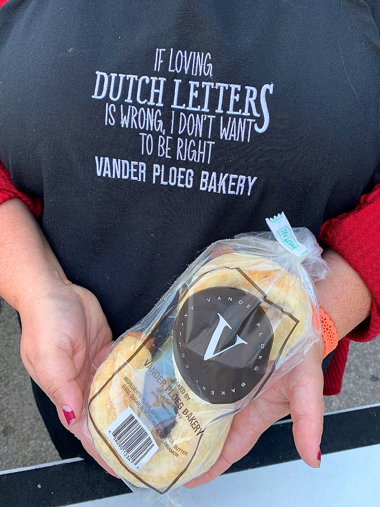 Woman holding Vander Ploeg package in Des Moines, Iowa.