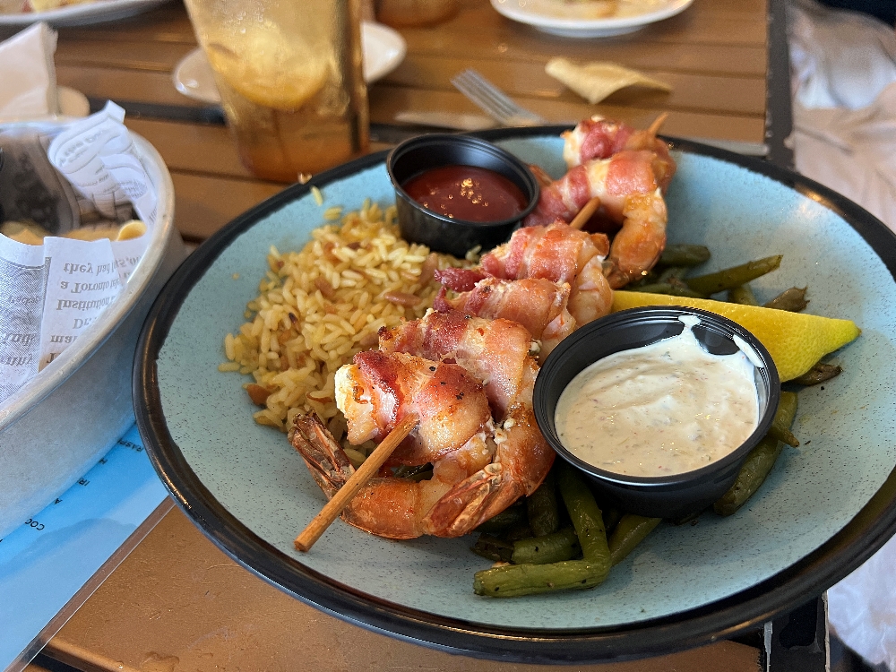 Bacon wrapped shrimp with rice and green beans from Doc's is one of the things to do in Corpus Christi.