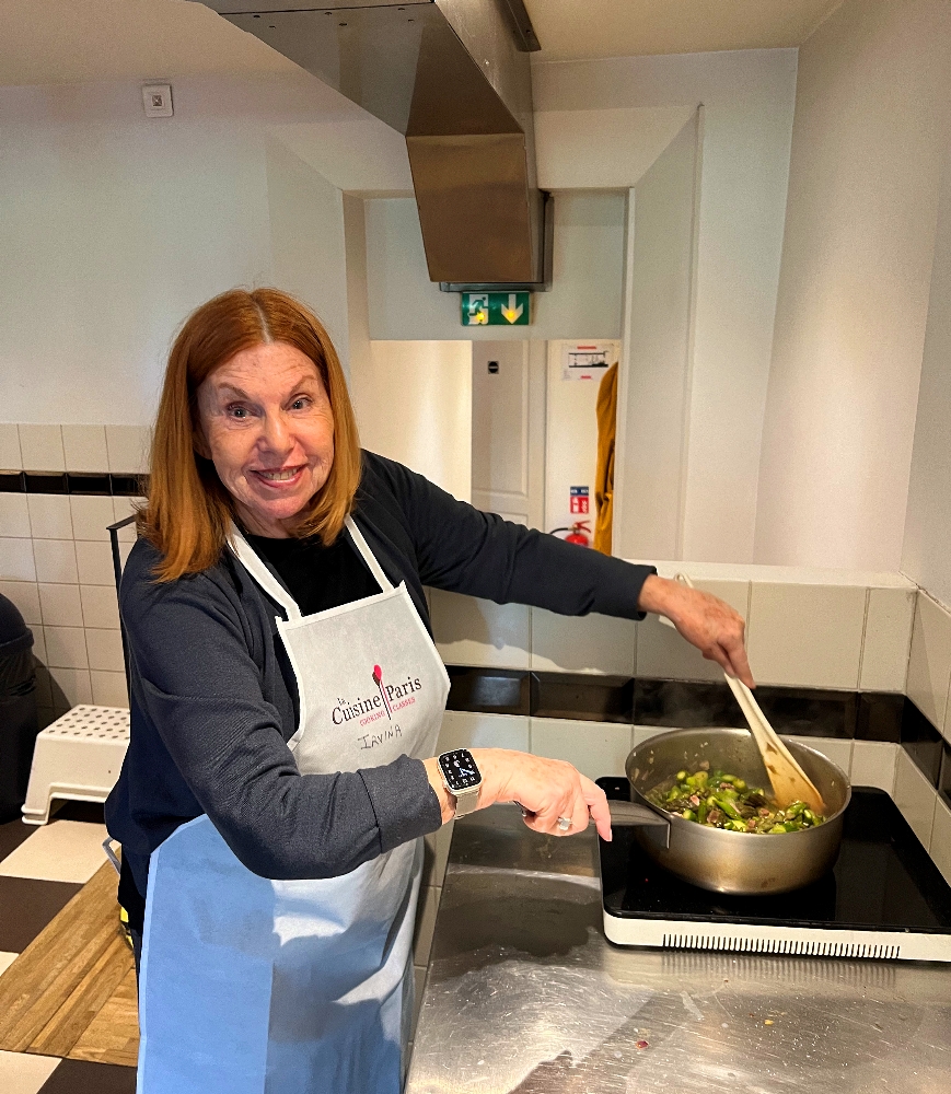 Author Irvina Lew stirring asparagus at La Cuisine Paris.