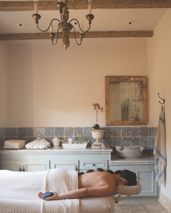 Woman getting hot stone massage.