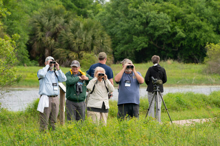 https://www.realfoodtraveler.com/wp-content/uploads/2024/12/Me-Galveston-Year-of-food-fun-and-culture-April-Featherfest-birding-and-nature-photography.jpg