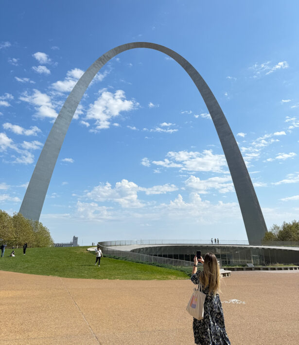 Person taking picture of the Gateway Arch at the National Park.