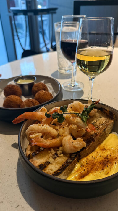 Two appetizers and wine are appetizers to choose from at Cana.