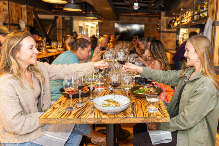 People at a wine pairing dinner at the Breckenridge Wine Classic .