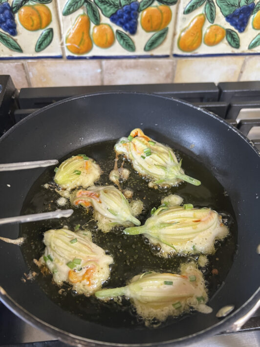 Frying zucchini blossoms in oil