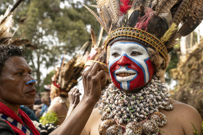 A woman from the Melpa tribe gets ready for the sing-sing. Photo by Donnie Sexton.